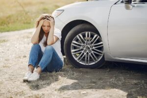 worried woman by car pexels for 010225